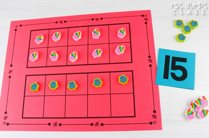 Mini erasers are added to ten frames to model the number 15