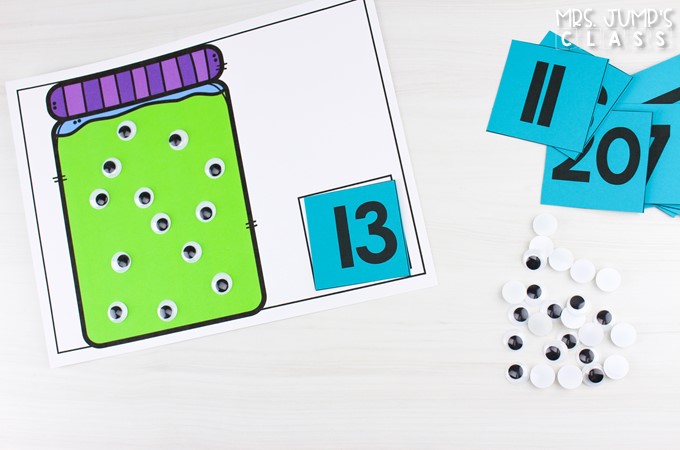 Googly eyes added to a jar-shaped counting mat to model the number 13