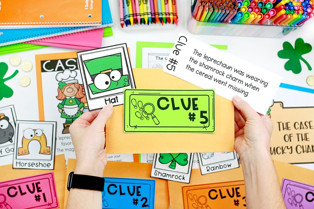 A hand is holding the clue #5 envelope, clue, and the hat suspect card
